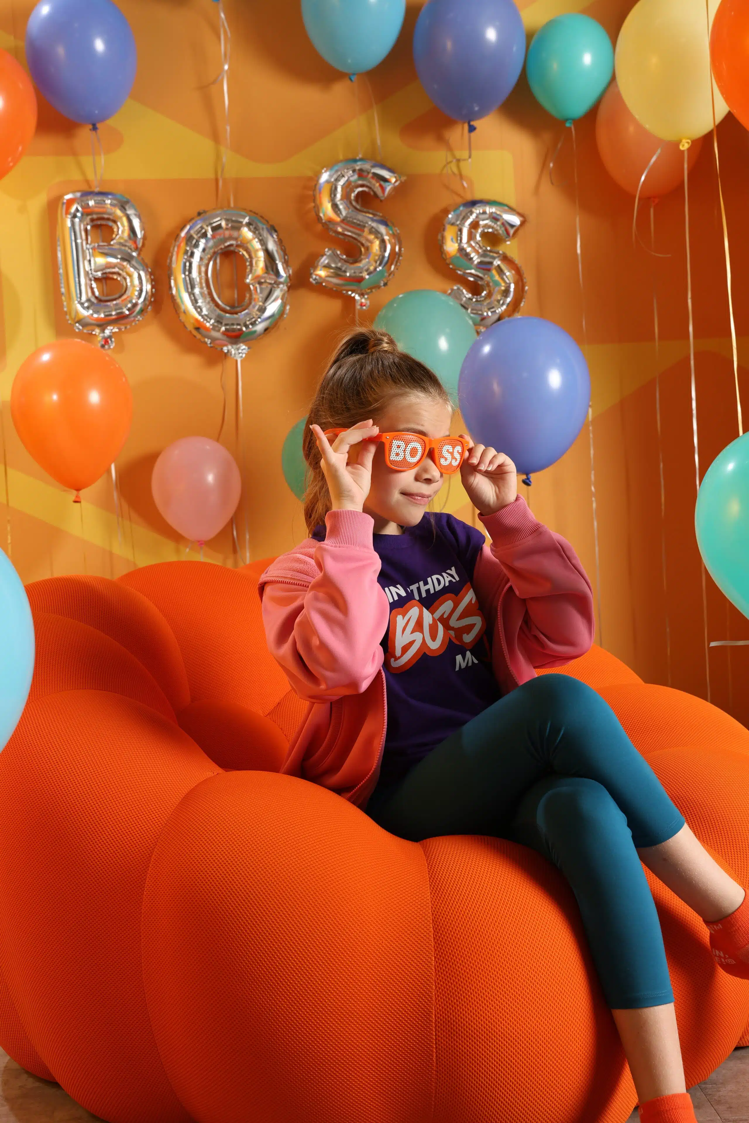 A birthday celebration with balloons and party glasses